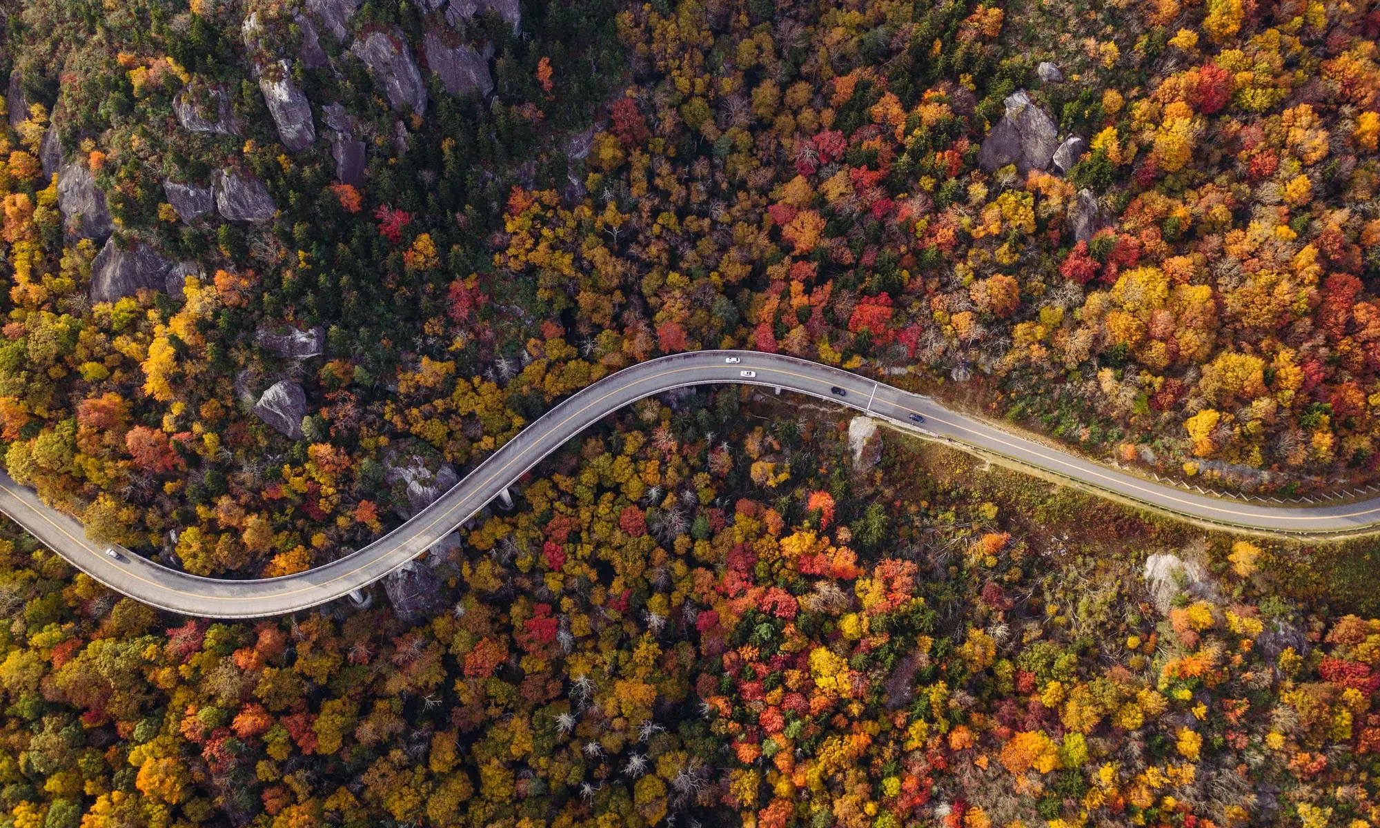 Scenic Blue Ridge Parkway winding through autumn mountains, ideal for weekend road trips